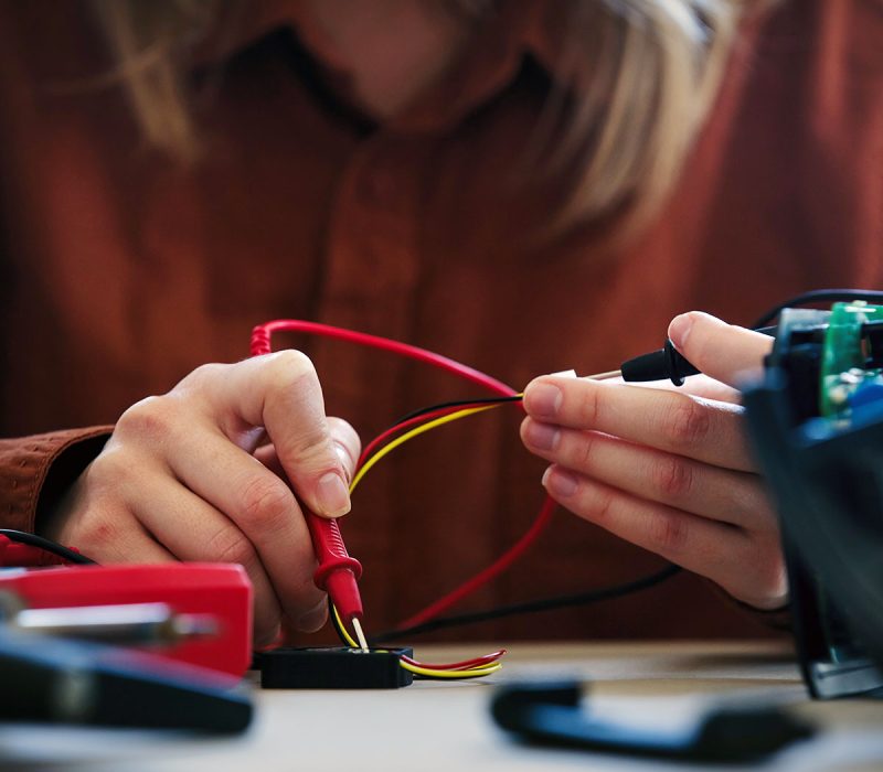 woman-repairing-electrical-appliance-at-home-2022-01-07-16-26-37-utc